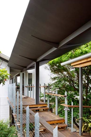 The townhouse is accessed via a bridge across the courtyard, intensifying the sense of intrigue as one approaches from the street